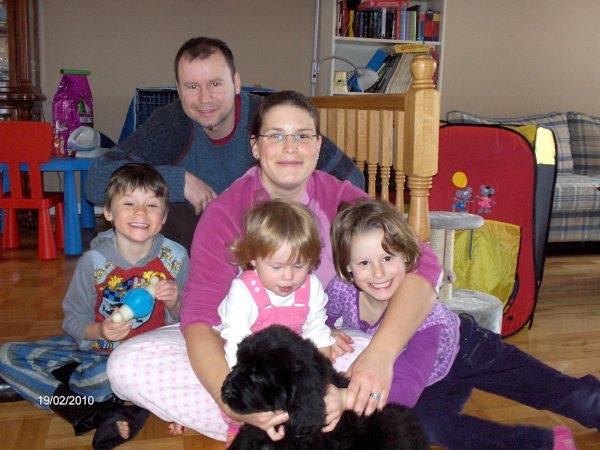 Newfoudland pup Belle with her new family.